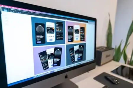 Computer screen displaying mobile app designs